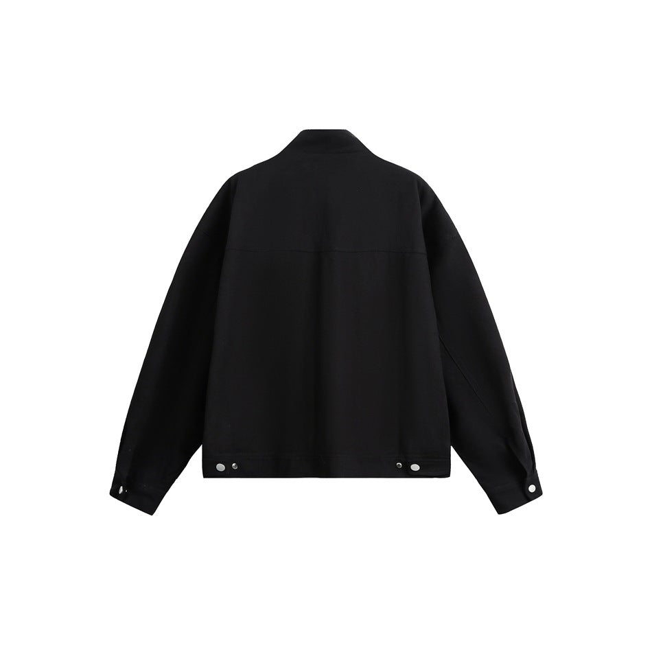 Back view of a black jacket with long sleeves, a stand collar and snap details at the hem and cuffs.