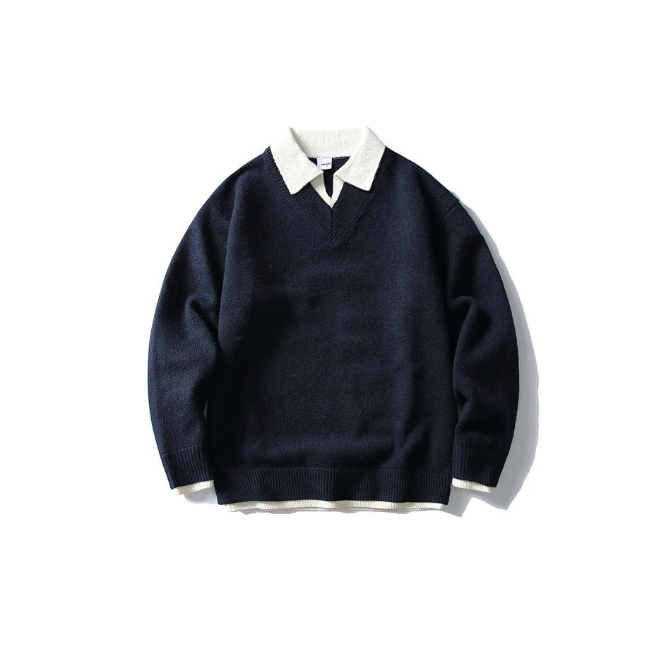 Navy V-neck knit sweater with cream polo collar and layered cream hem, flat lay front view