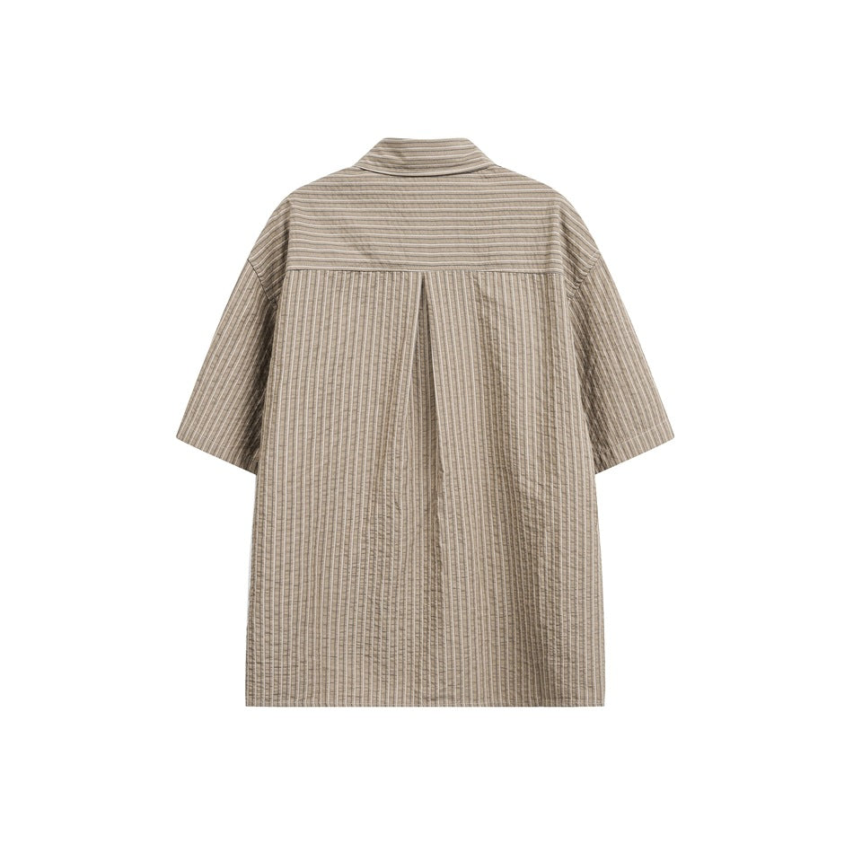 Back view of a taupe striped short-sleeve button-up shirt, showing its horizontal yoke and center pleat.