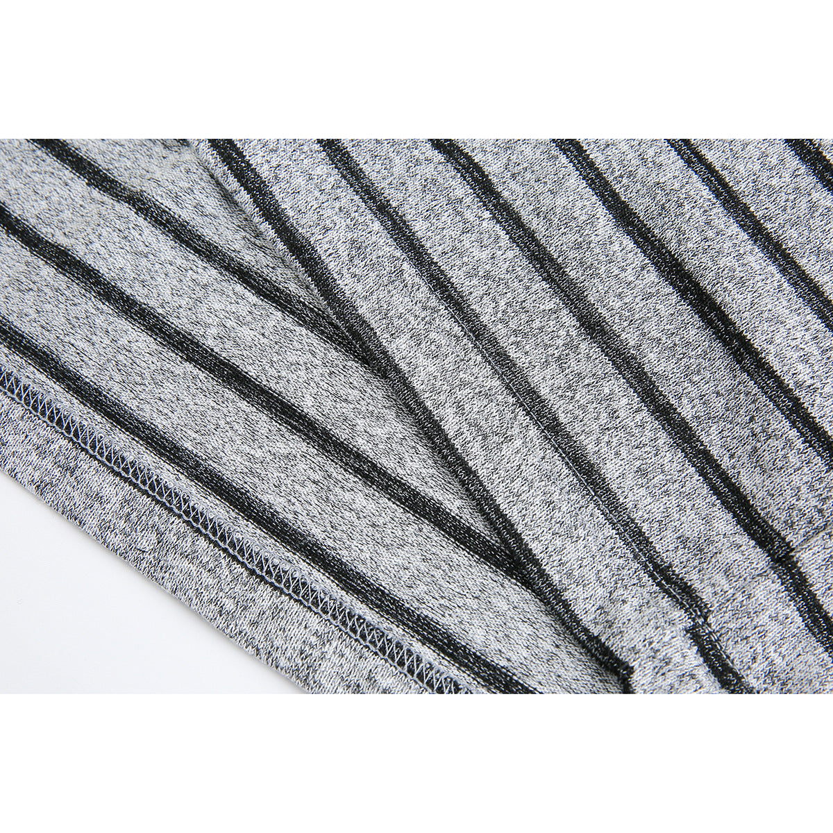 Close-up of gray-and-black striped fabric showing the inside and stitched hem seam.