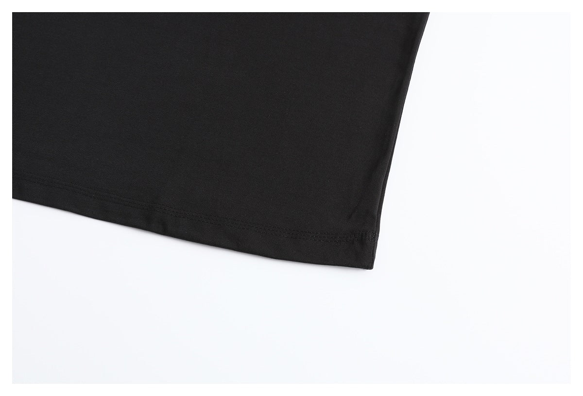 Close-up of the black T-shirt's bottom hem and stitching.
