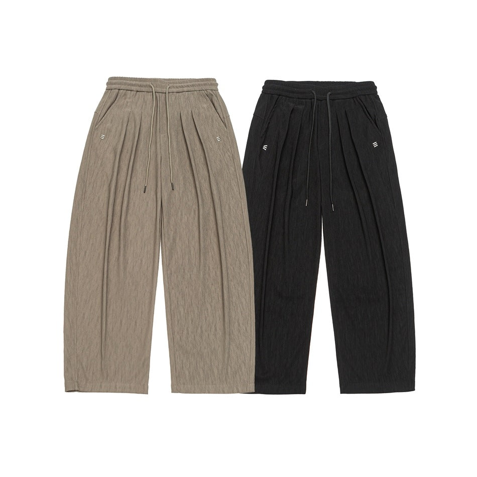 Taupe and black wide-leg drawstring pants shown side by side against a white background.