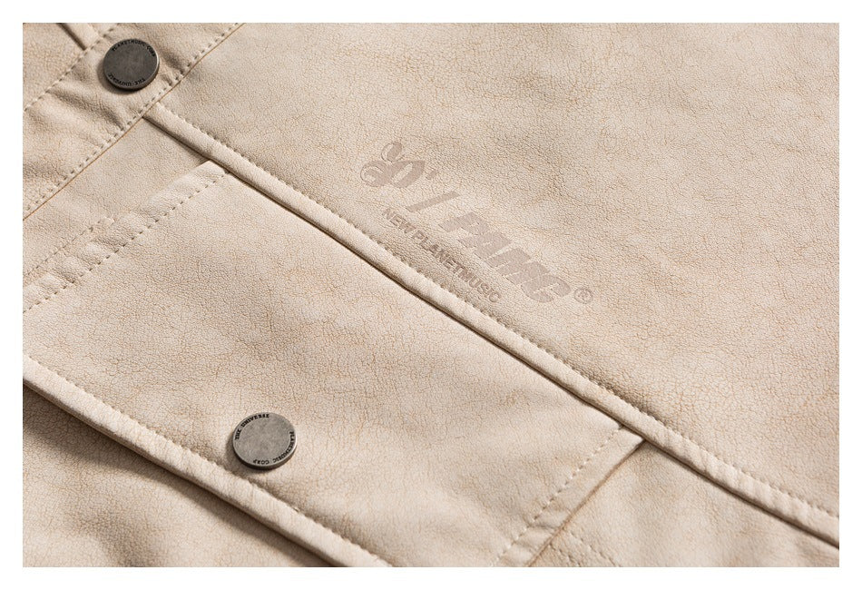 Close-up of a cream jacket's front placket, buttons, and embossed English branding.