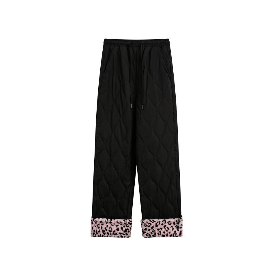 Black quilted drawstring pants with pink and black leopard-print fleece-like turned-up cuffs, flat front view