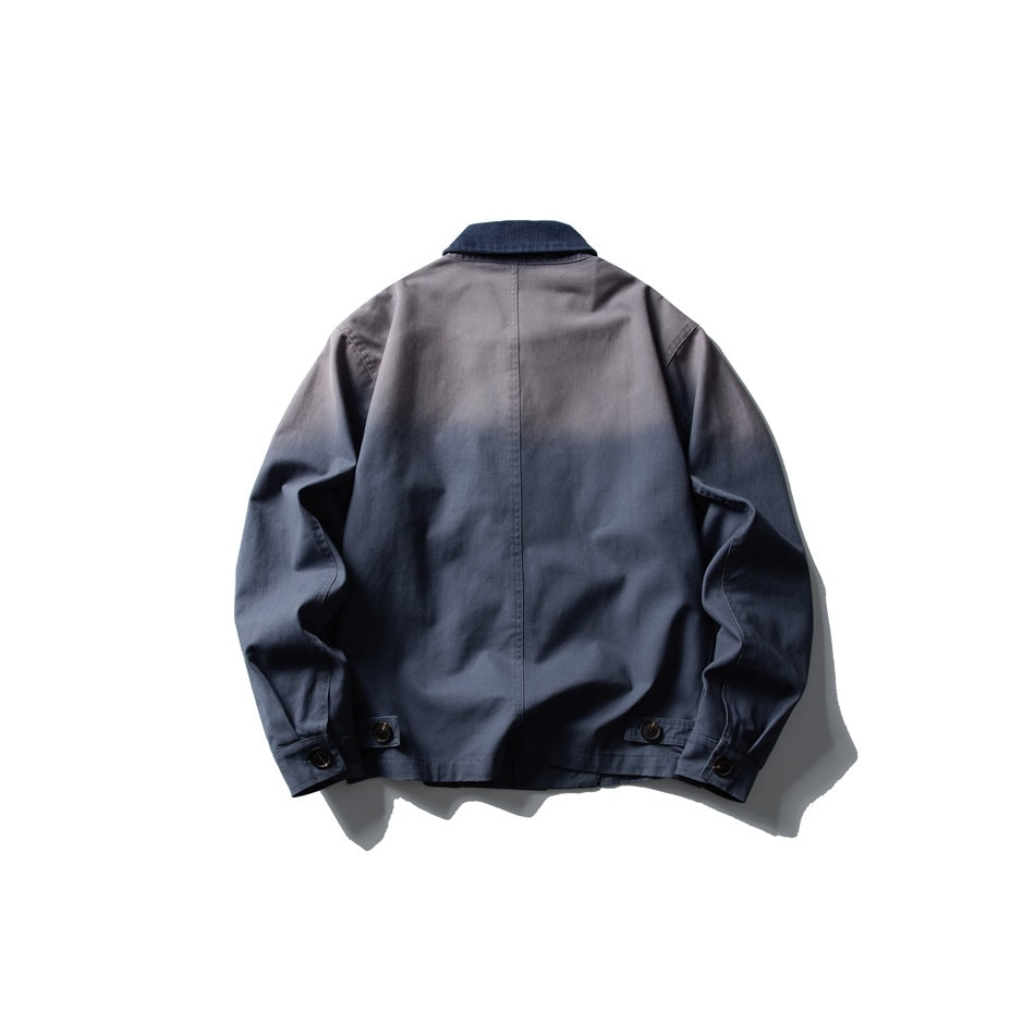 Back view of a gray-blue jacket with a dark navy collar, center seam, and buttoned cuffs.