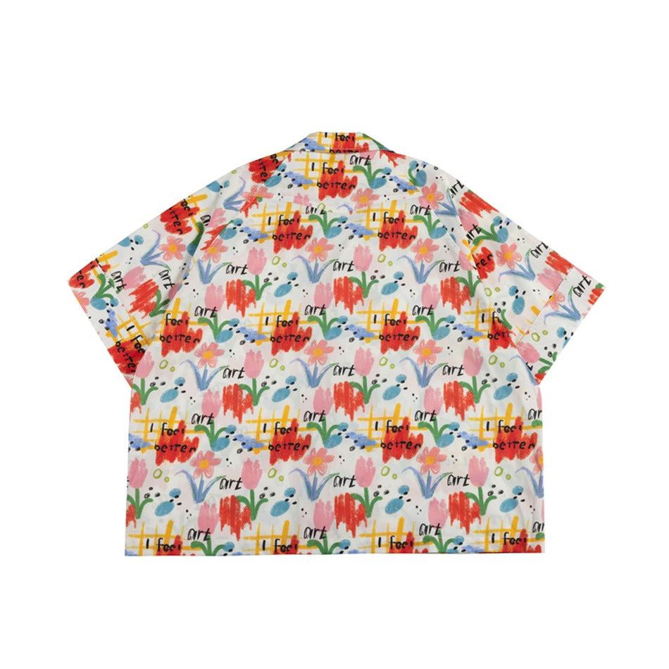 Flat-lay back of a short-sleeve shirt with allover colorful floral and 'I feel better' art print