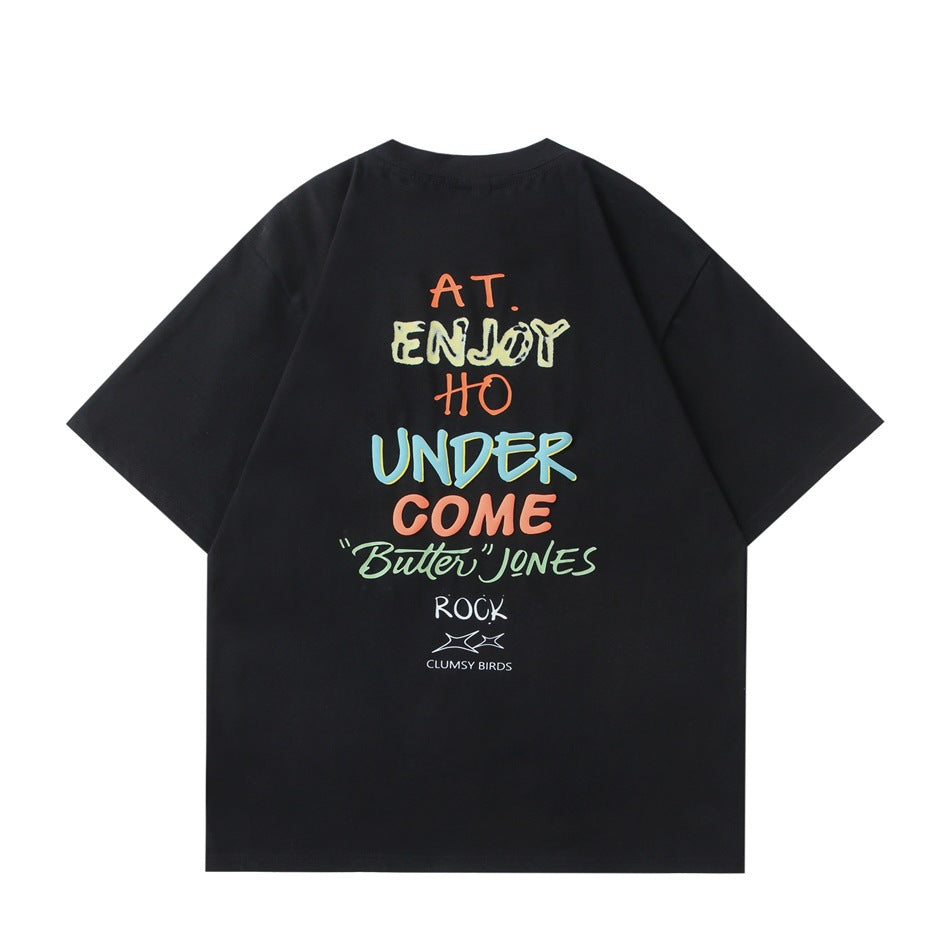 Back of a black T-shirt with large multicolor lettering print and small text and logo below