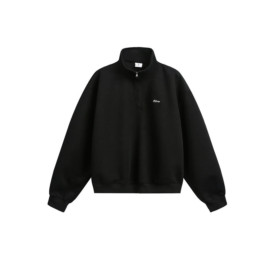 Black quarter-zip stand-collar sweatshirt flat lay with small white embroidered chest text