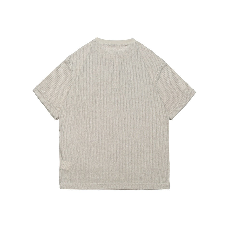 Back view of beige ribbed knit short-sleeve top flat lay with raglan sleeves and ribbed neckline trim