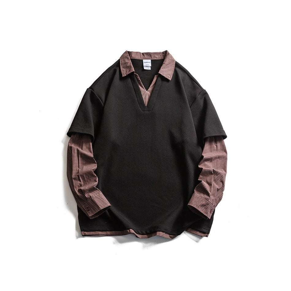 Black faux two-piece V-neck top with red-brown plaid collar, long sleeves and hem trim, flat lay