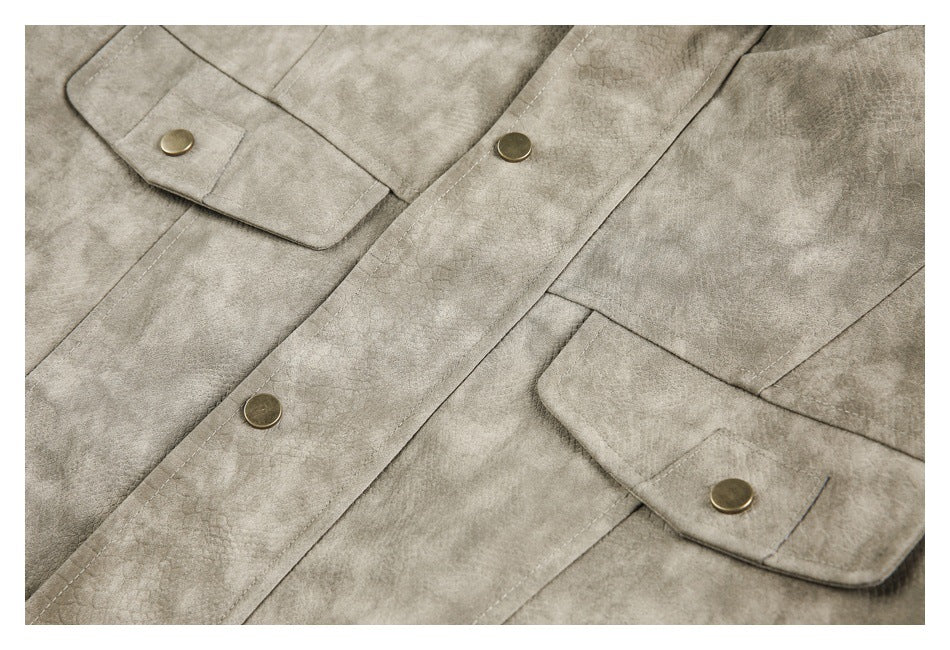 Close-up of a taupe jacket front showing snap-button flap pockets and a snap-button placket.