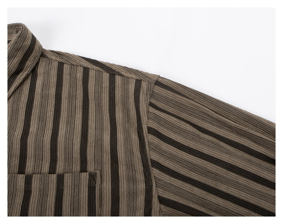 Close-up of the striped shirt's shoulder, sleeve, and part of its chest pocket.