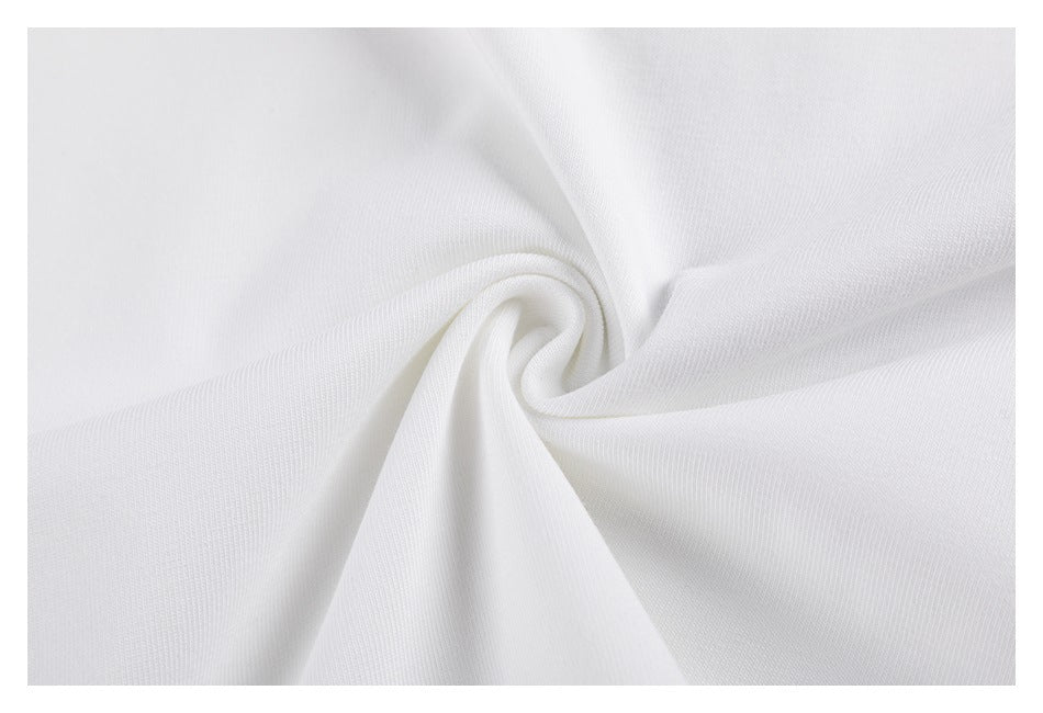 Close-up of white T-shirt fabric gathered into a twist to show its surface and drape.
