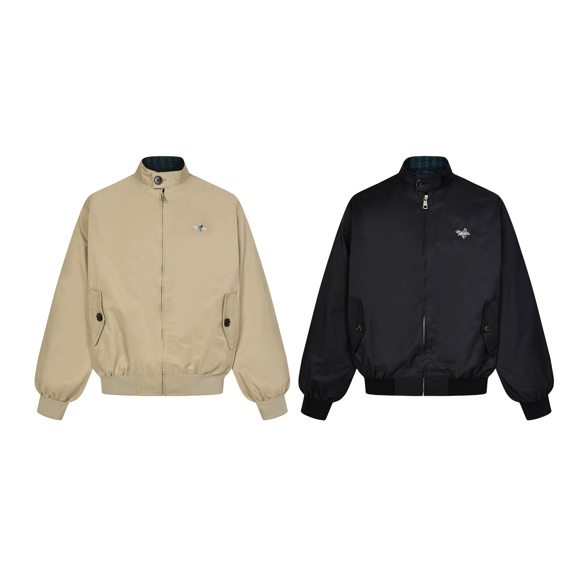 Front view of tan and black zip-up jackets with stand collars, plaid lining, ribbed cuffs, and hem.