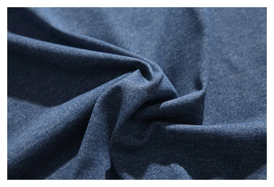 Close-up showing the heathered blue T-shirt fabric gathered into soft folds.