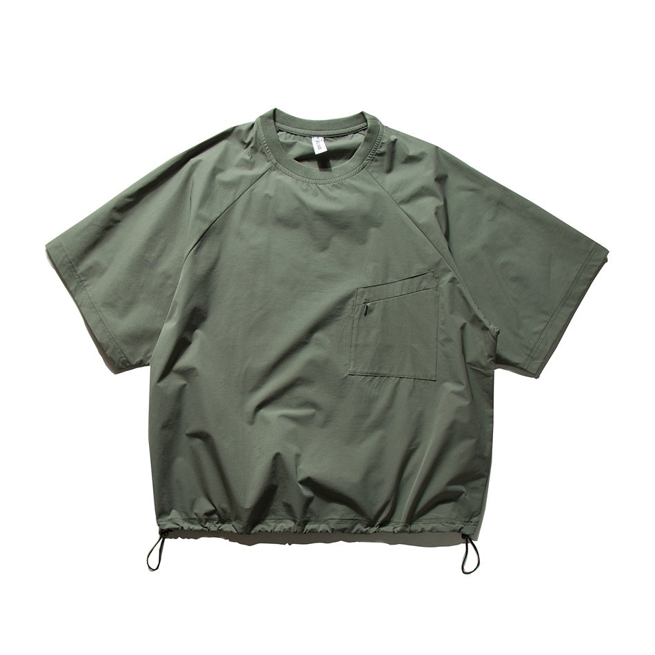 Gray green short-sleeve crew-neck top with raglan sleeves, zip chest pocket and drawcord hem, flat lay front view
