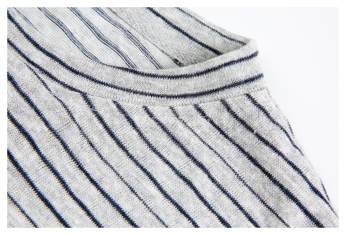 Close-up of the striped shirt's collar and shoulder seam.