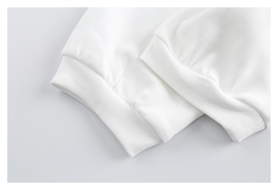 Close-up of folded white garment cuffs and sleeve seams.