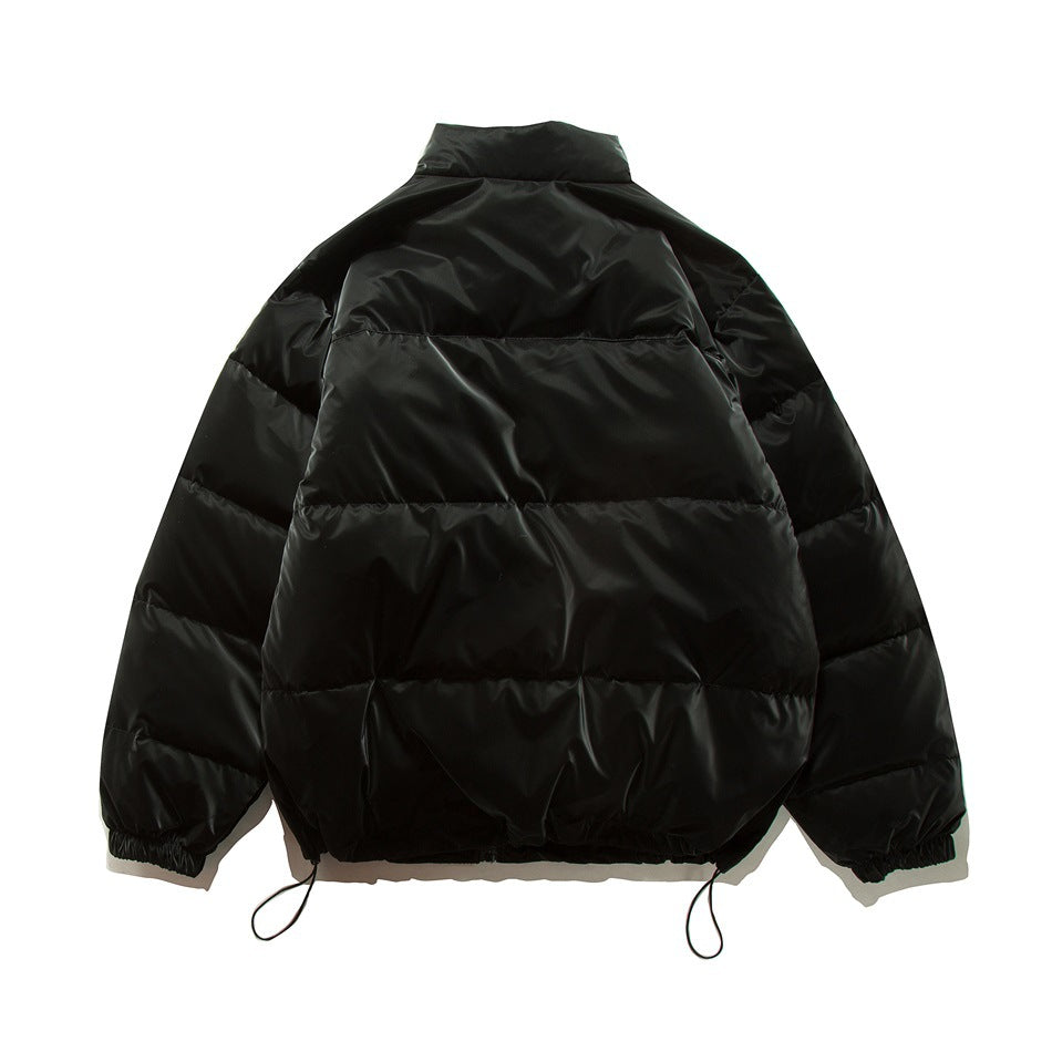 Back view of a black quilted puffer jacket with a high collar, elastic cuffs and adjustable hem cords.