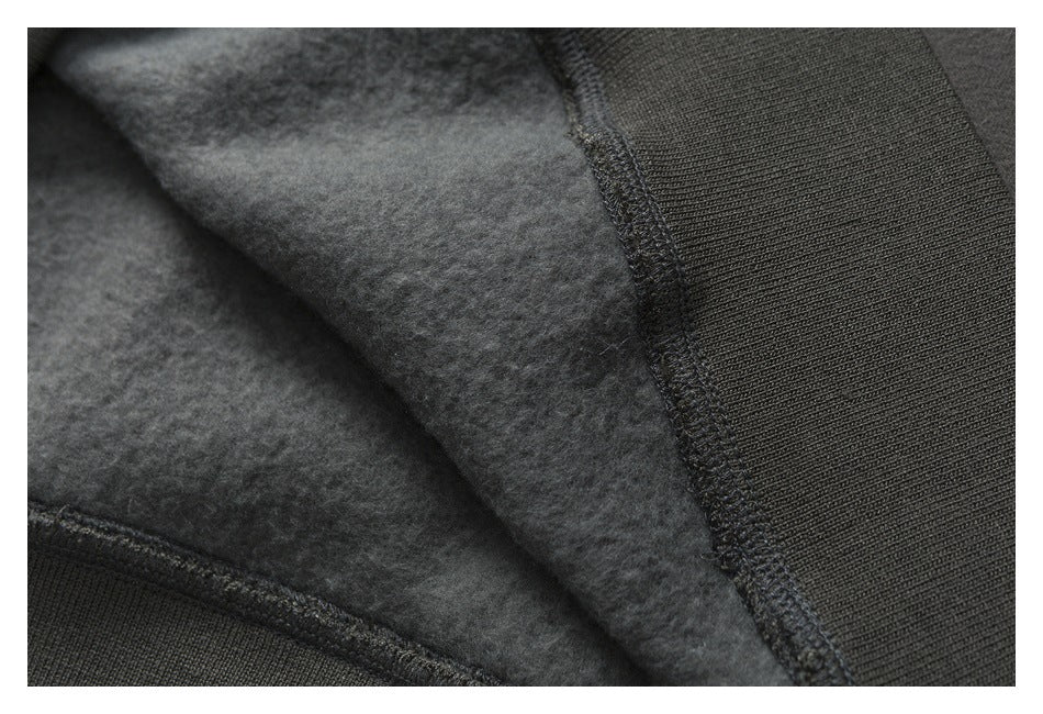 Close-up of the garment's soft-looking brushed interior beside a seam and ribbed edge.