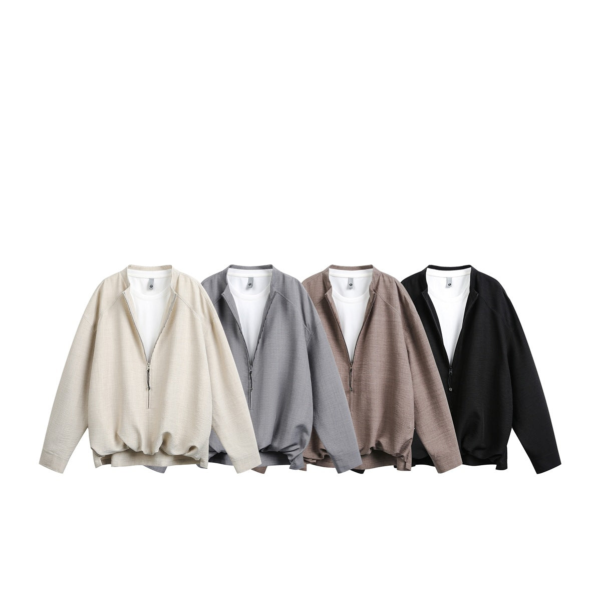 Four front-facing zip jackets in cream, gray, taupe, and black, each layered over a white shirt.