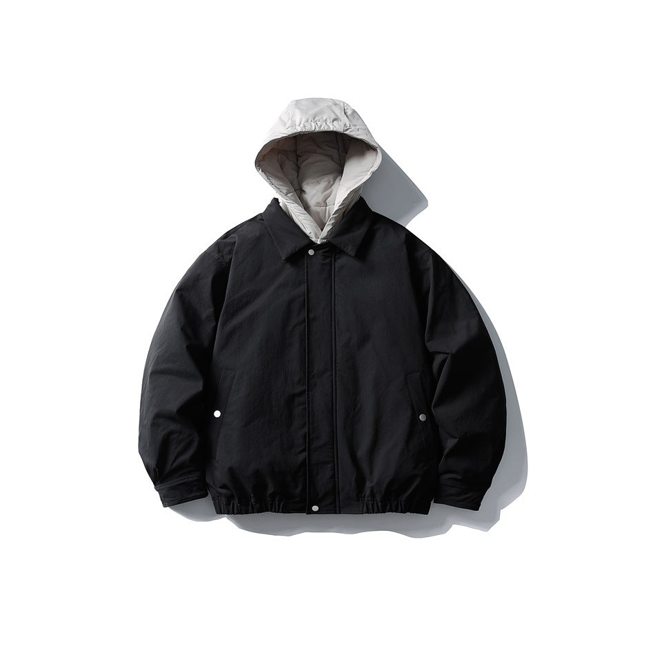 Black men's jacket with light gray hood, collar, front snap placket and elastic hem, flat front view