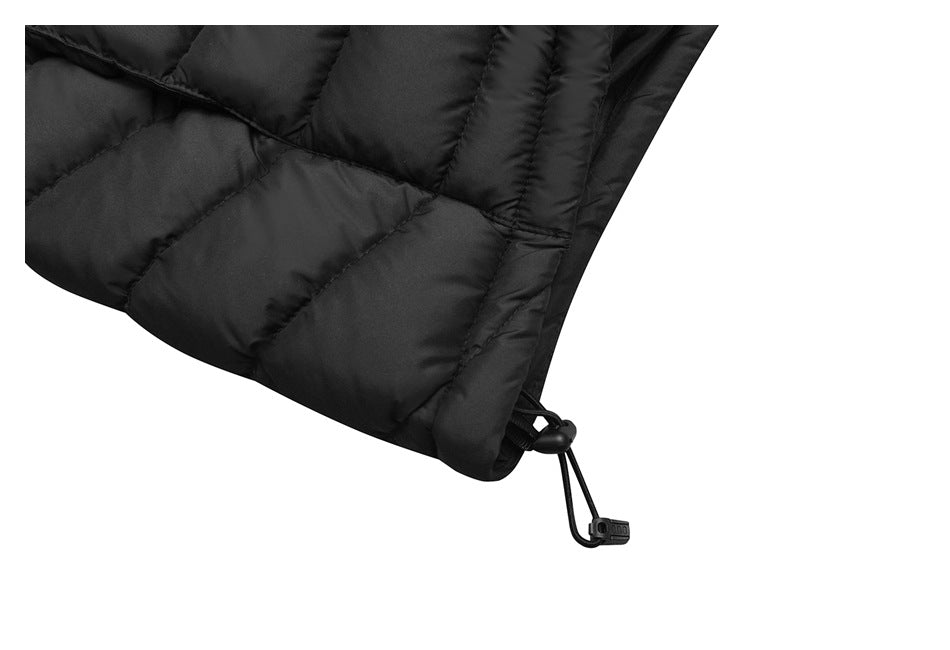 Close-up of a black quilted jacket hem with a drawcord and adjustable toggle.