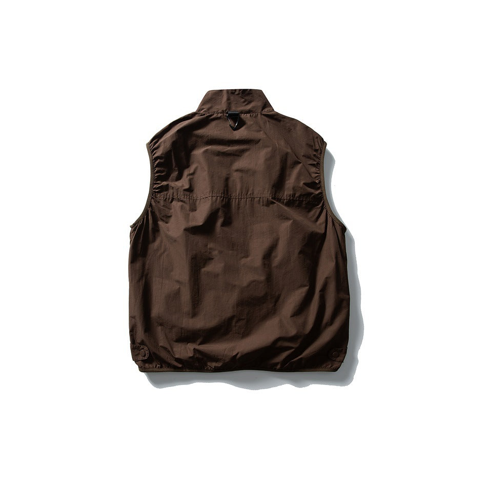 Back view of a brown sleeveless vest with a high collar, back yoke seam, and snap details near the hem.