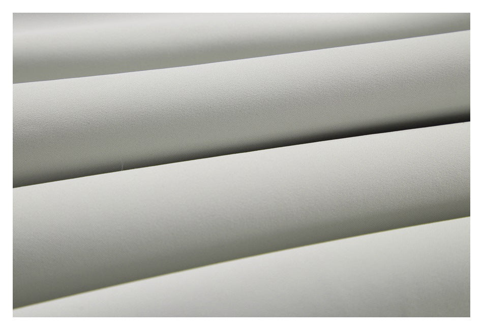 Close-up of smooth light gray fabric arranged in parallel folds.