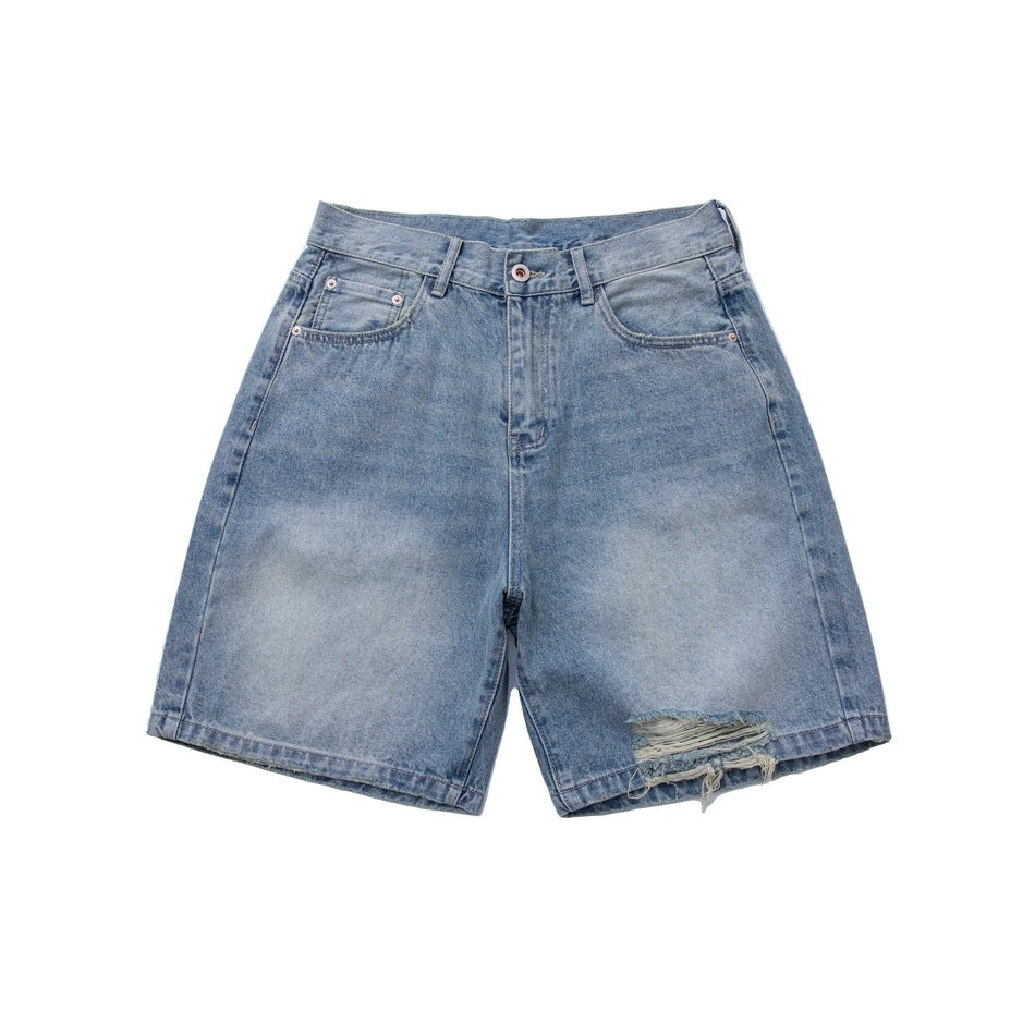 Light blue washed denim shorts, front view, with a frayed hole near the hem of one leg