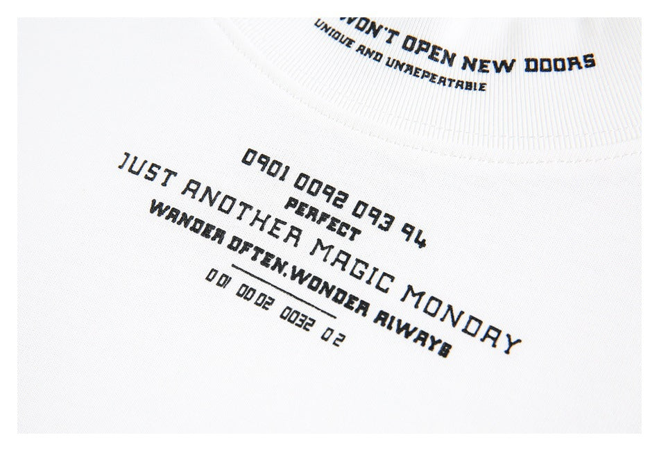 Close-up of black English text printed on the front of a white shirt, with part of the collar visible.