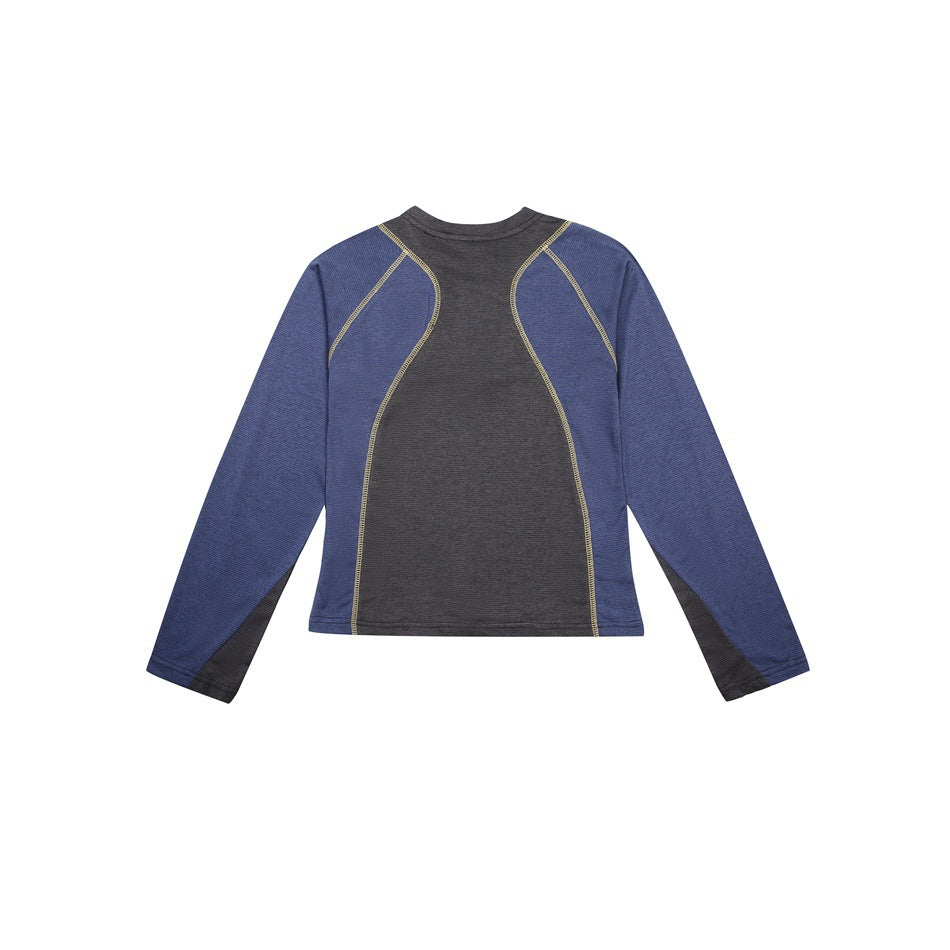 Flat view of a long-sleeve athletic top with a charcoal center panel, blue sleeves and yellow seam stitching.