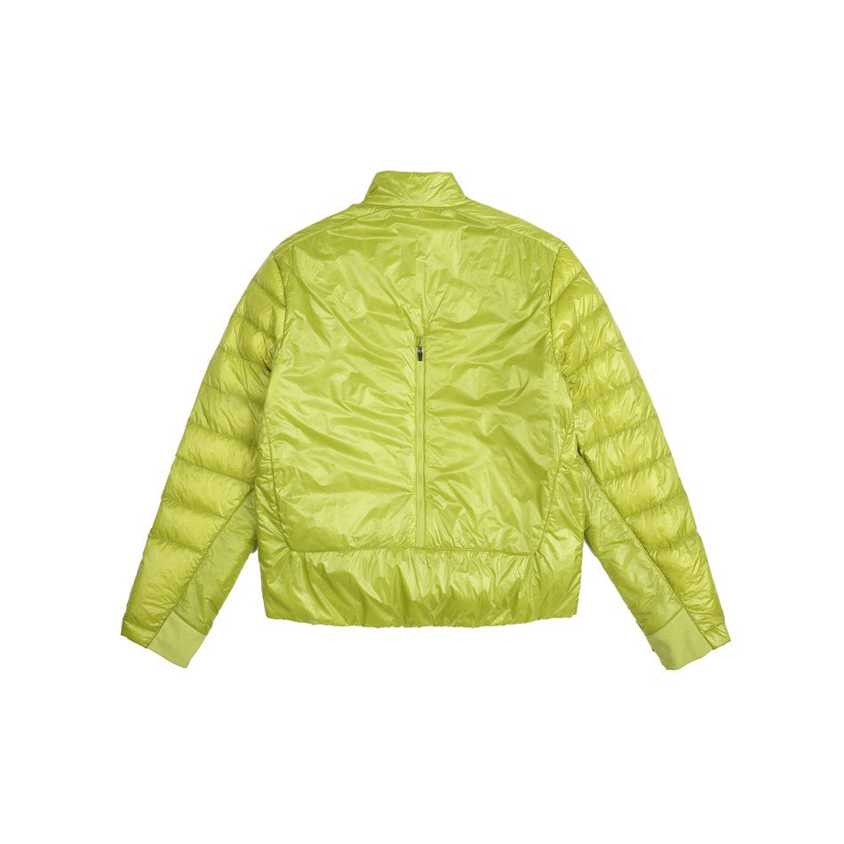 Back view of a bright chartreuse quilted jacket with a stand collar, center-back zipper, and elastic cuffs and hem.