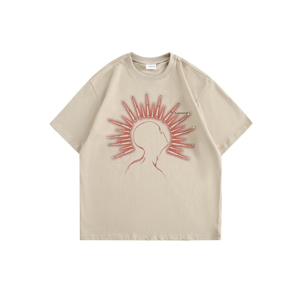 Apricot short-sleeve crew-neck T-shirt with red-orange head silhouette and radiating ray graphic with metallic dots