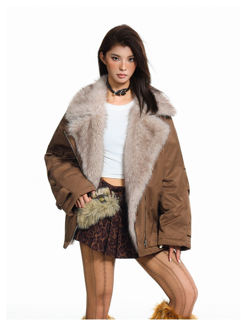 Close-up of a model wearing the brown jacket open, showing the wide plush faux-fur-look lapel collar and zipper