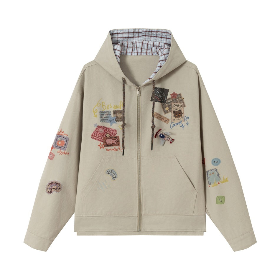 Beige zip-front hooded jacket with plaid hood lining, front pocket and colorful patch and embroidery details