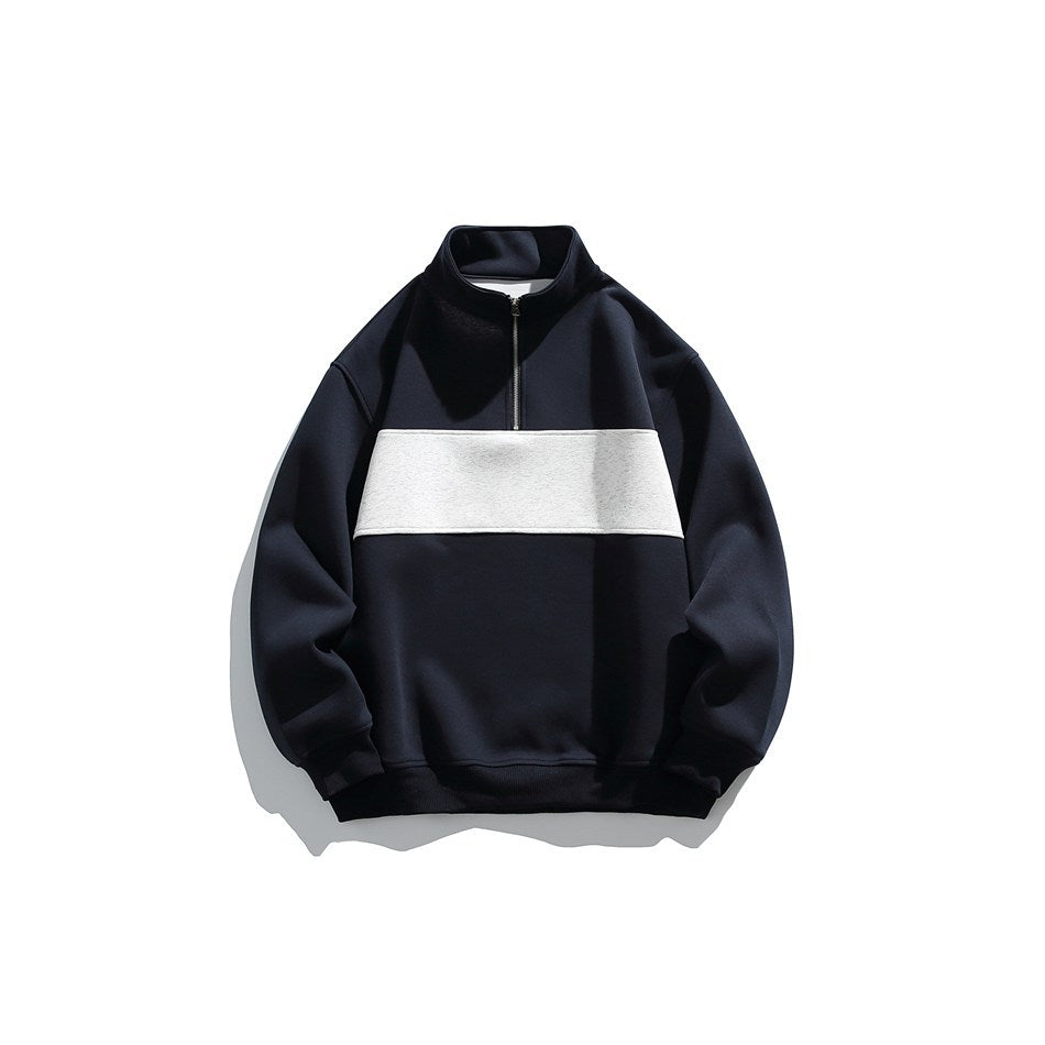 Navy half-zip stand-collar sweatshirt with a light gray chest panel, flat front view