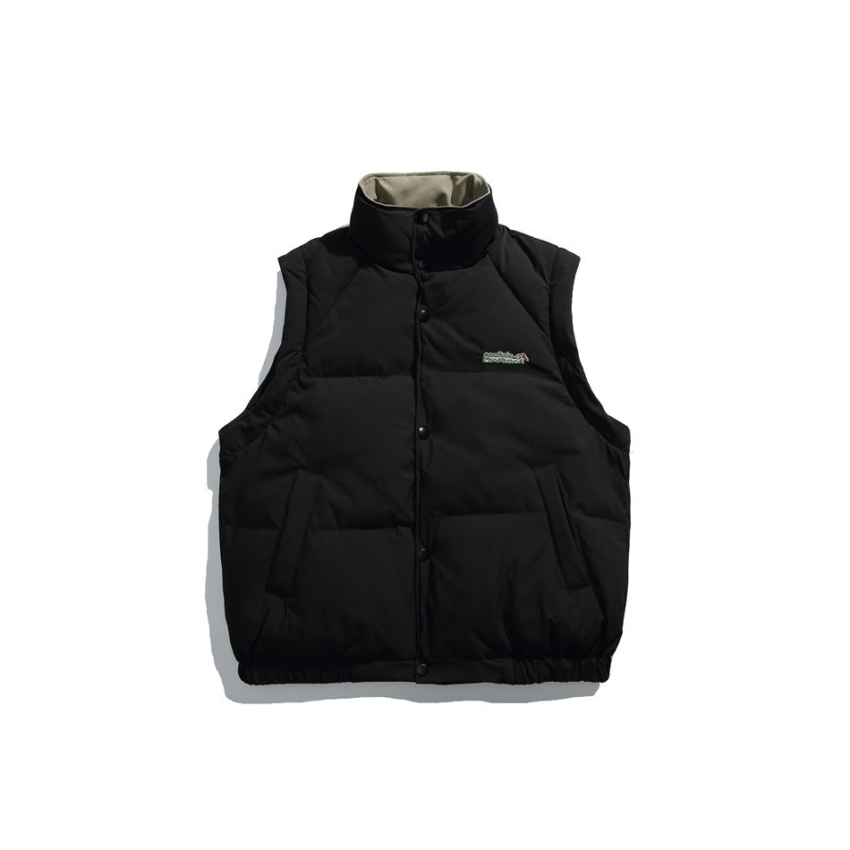 Front view of a black sleeveless quilted vest with a high collar, snap-front closure, and angled pockets.