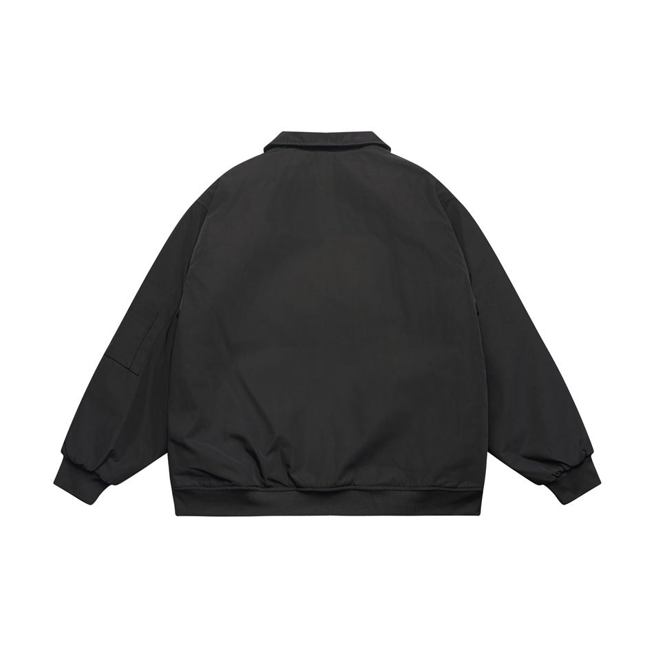 Back view of a black collared jacket with long sleeves and ribbed cuffs and hem.