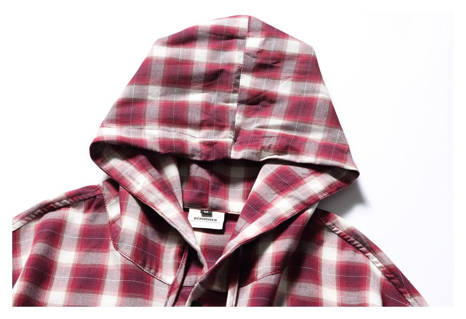 Close-up of the red plaid shirt's hood, neckline, and sewn-in neck label.