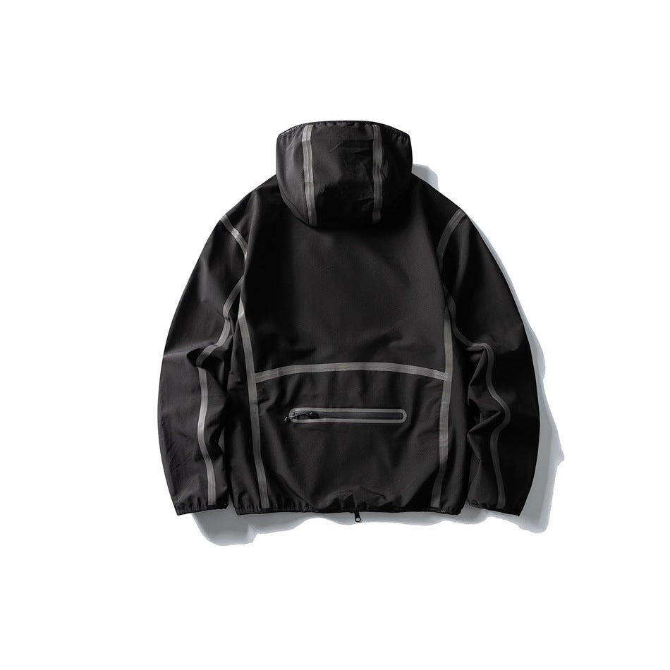Back view of a black hooded jacket with gray contrast seam trim and a horizontal zip pocket.