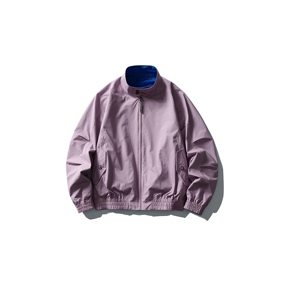 Mauve pink stand-collar zip jacket flat lay with blue reverse visible at collar
