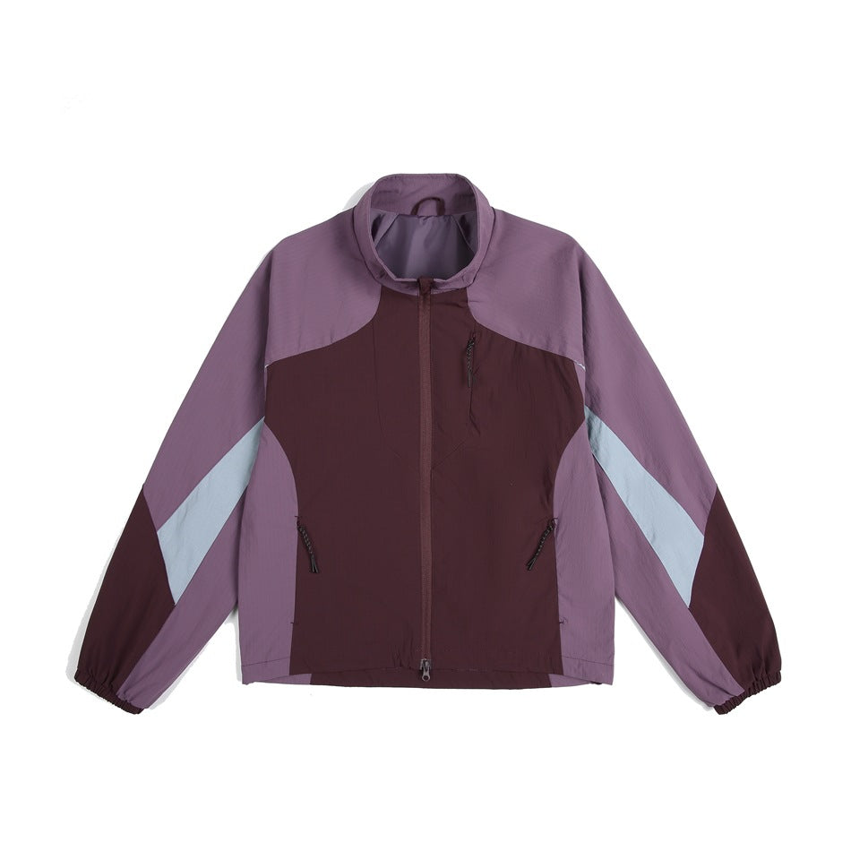 Purple and burgundy color-block zip jacket with stand collar, pale blue sleeve stripes and elastic cuffs, flat front view
