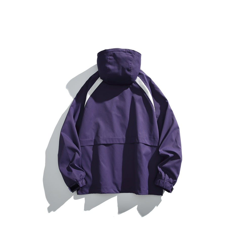 Back view of a purple hooded pullover jacket with white shoulder accents and elastic cuffs, laid flat.