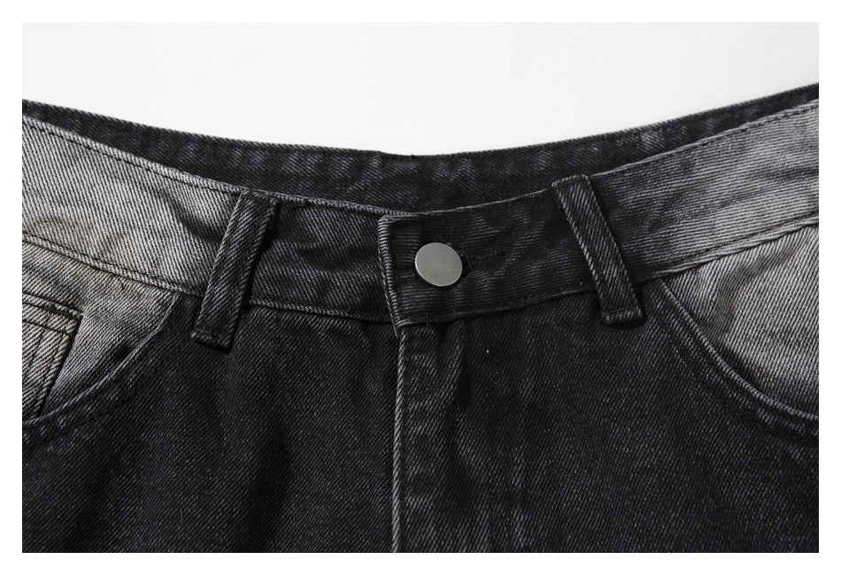 Close-up of the denim shorts' waistband, button, belt loops, and front fly.