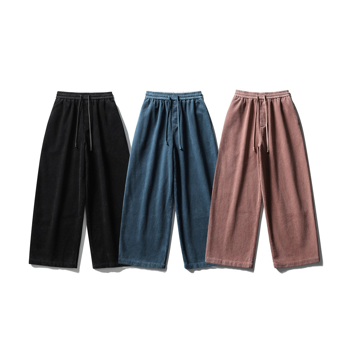 Three pairs of wide-leg drawstring pants shown from the front in black, blue, and dusty rose.