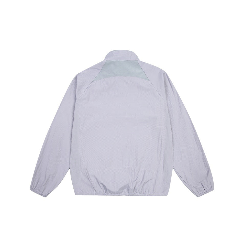 Back view of a pale lavender long-sleeve jacket with a light gray-green upper-back panel.