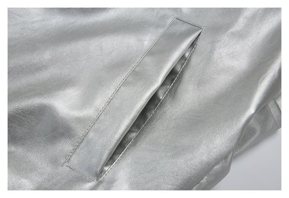 Close-up of a long welt pocket on the silver jacket.