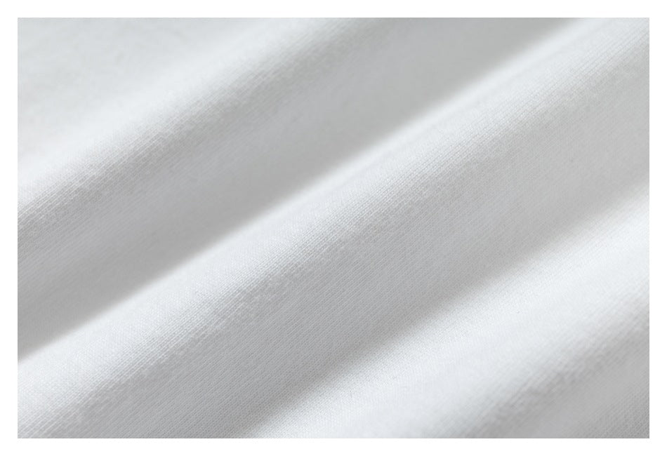Macro close-up showing the fine knit texture of plain white fabric.