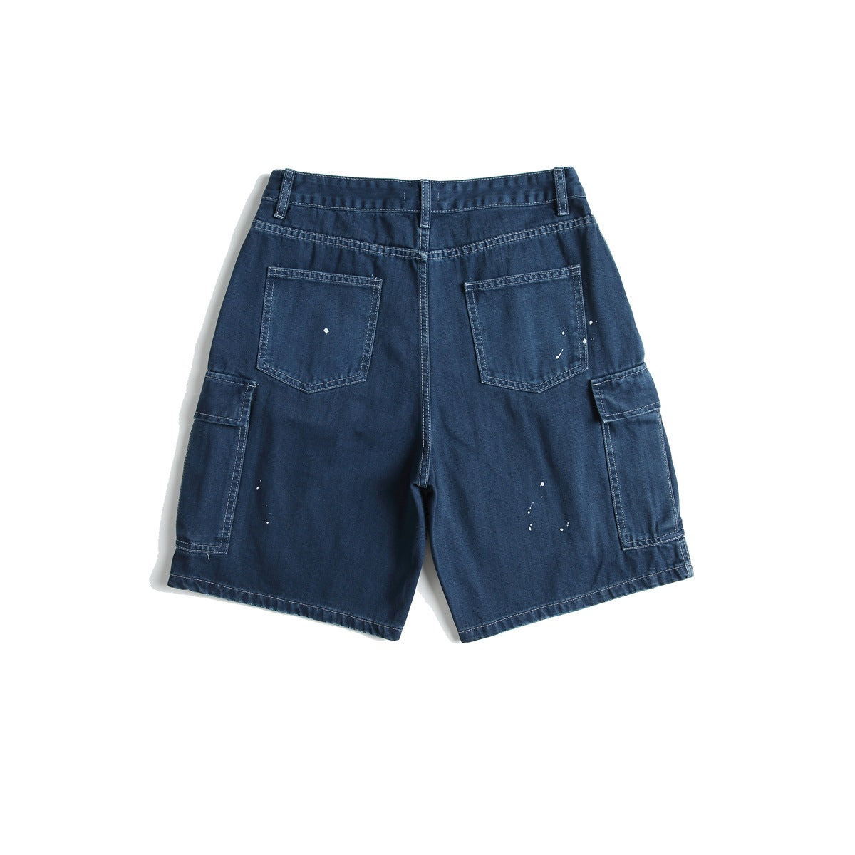 Back view of blue cargo shorts with two patch pockets, side flap pockets and white paint splatters